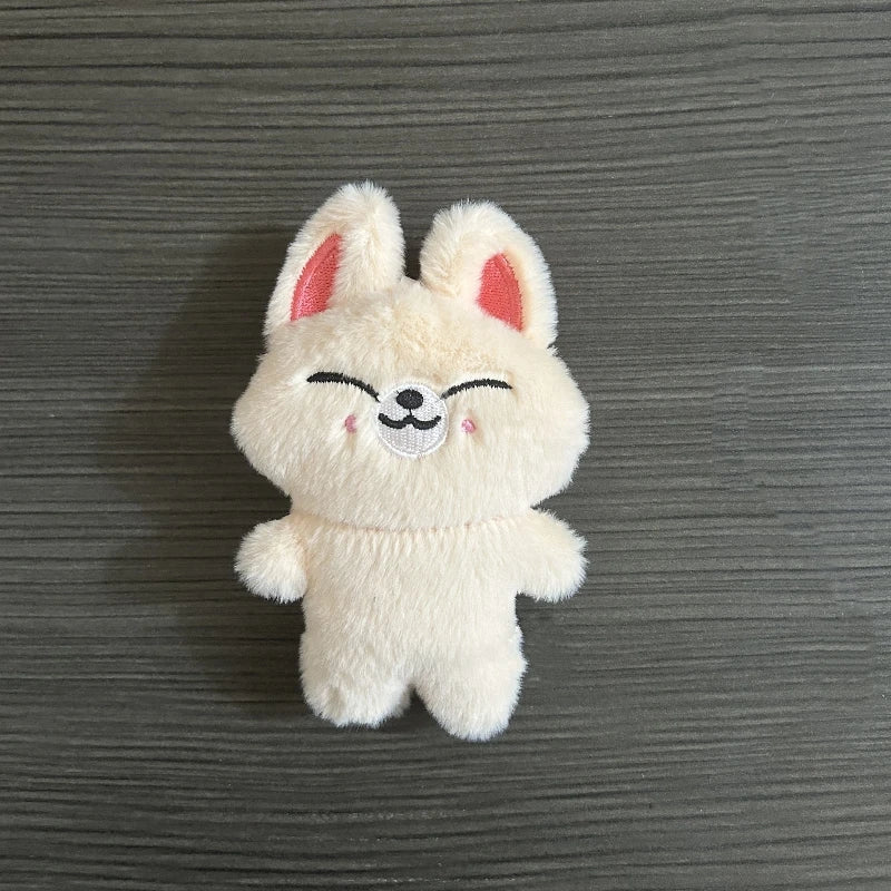 Charmoji Cheeku – cute cream plush keychain with a sweet smiling face, kawaii soft toy bag charm