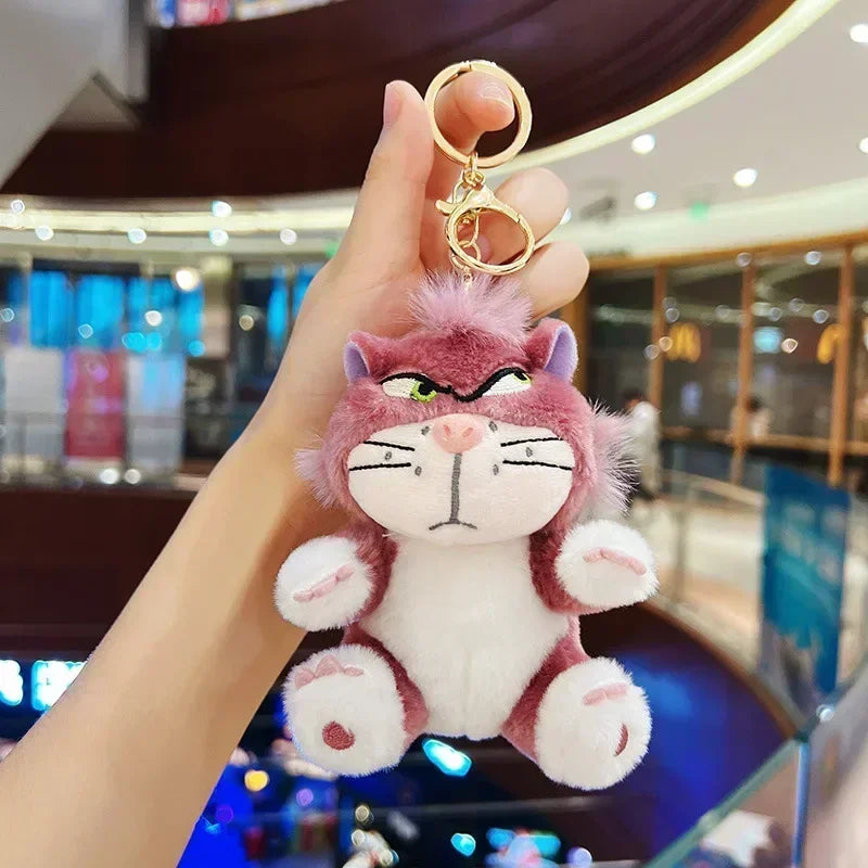 Cute grumpy plush keychain used as a fun bag accessory