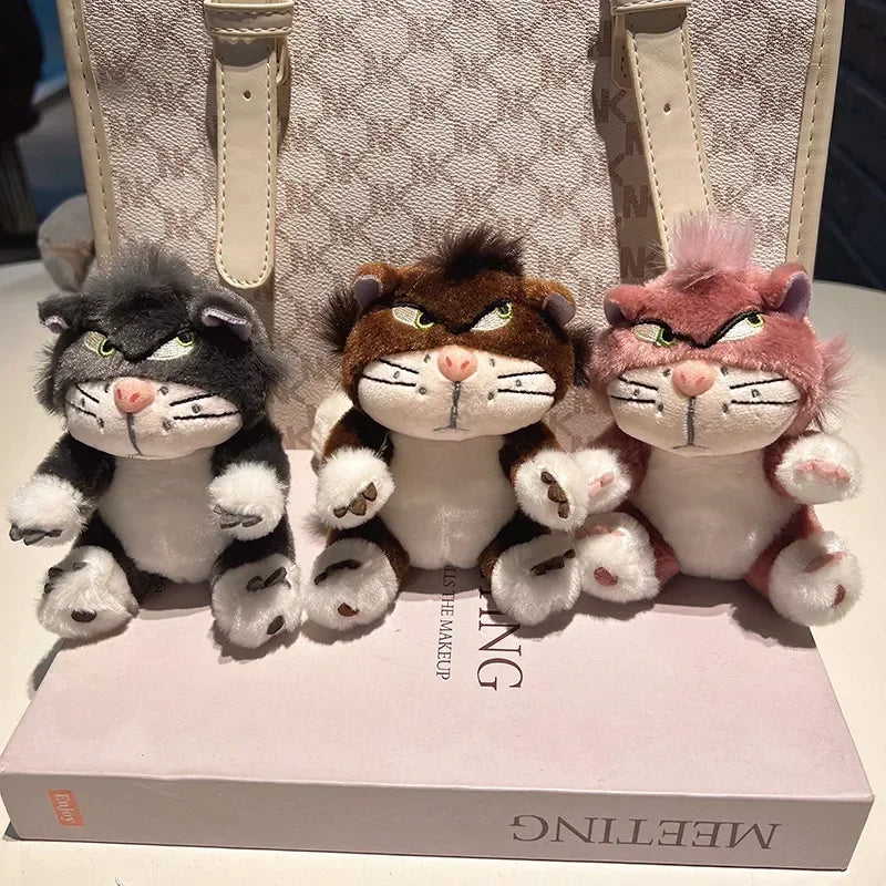 Three grumpy cat plush keychains displayed together for product showcase