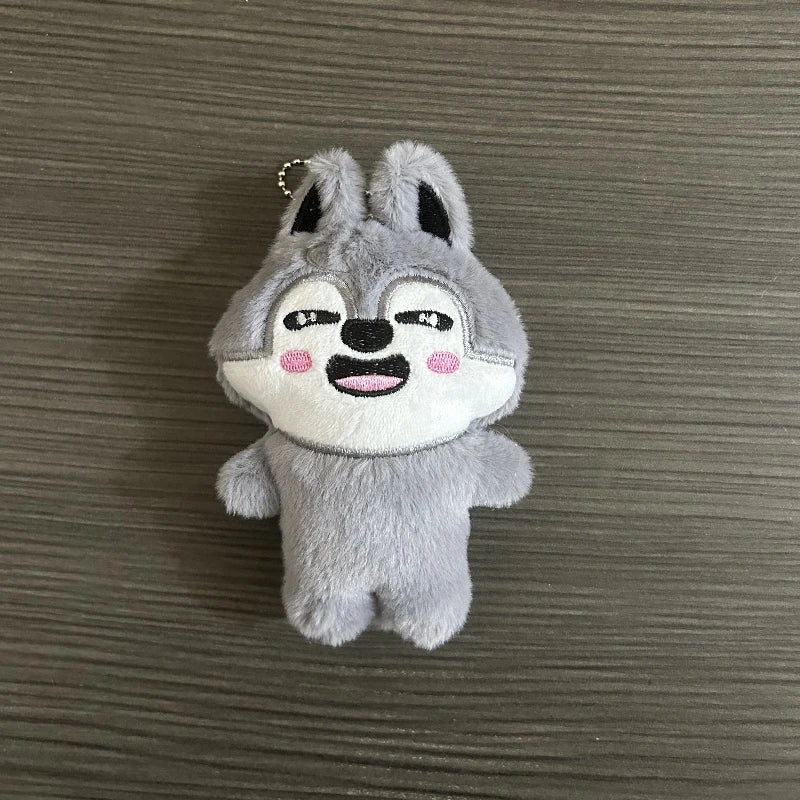 Charmoji Slicko – gray wolf plush keychain with confident smirk, cool expressive kawaii collectible charm